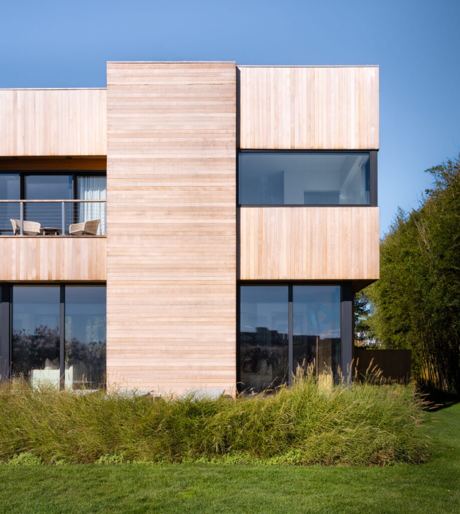 Modern coastal home exterior with wood siding