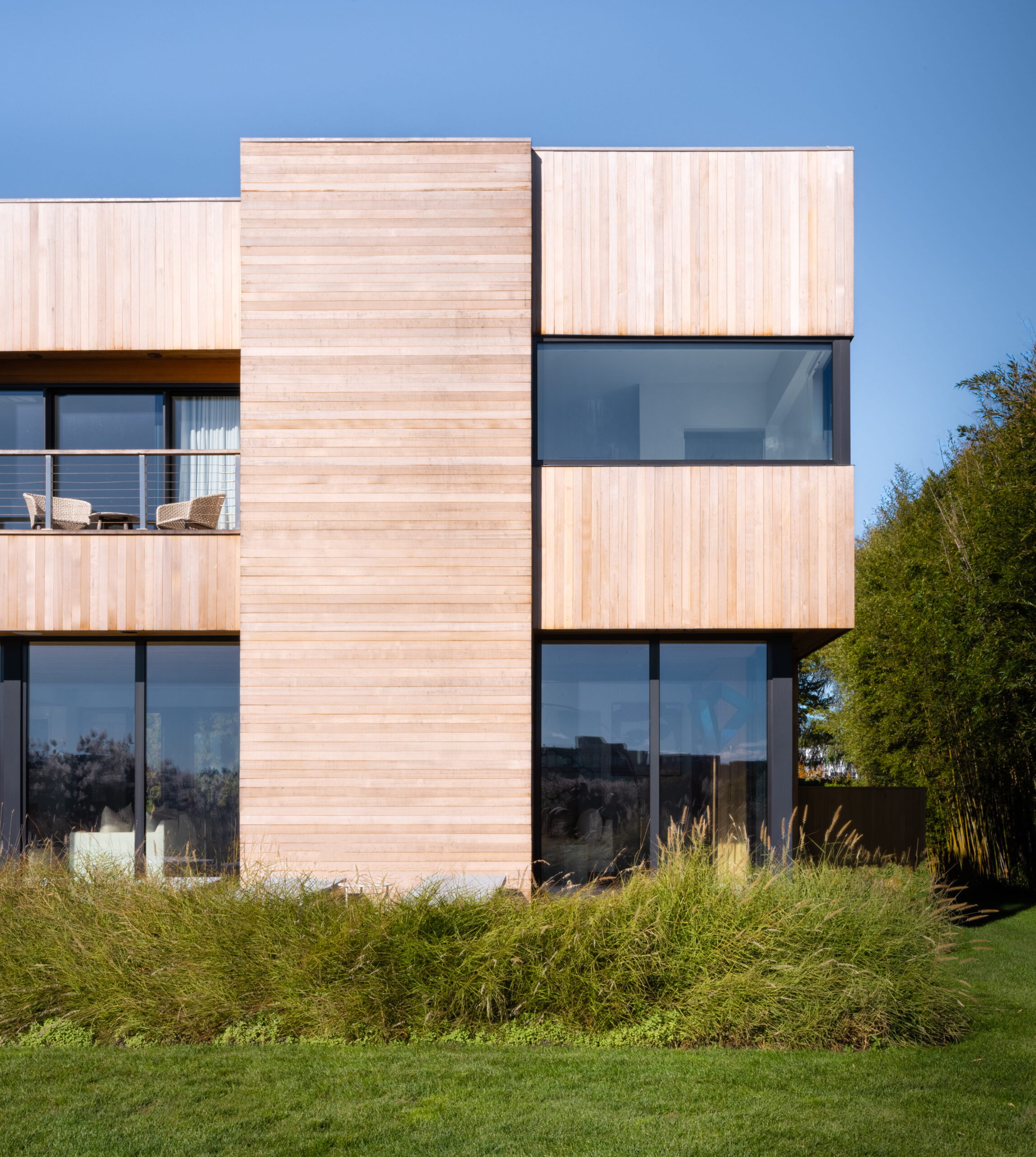 Modern coastal home exterior with wood siding